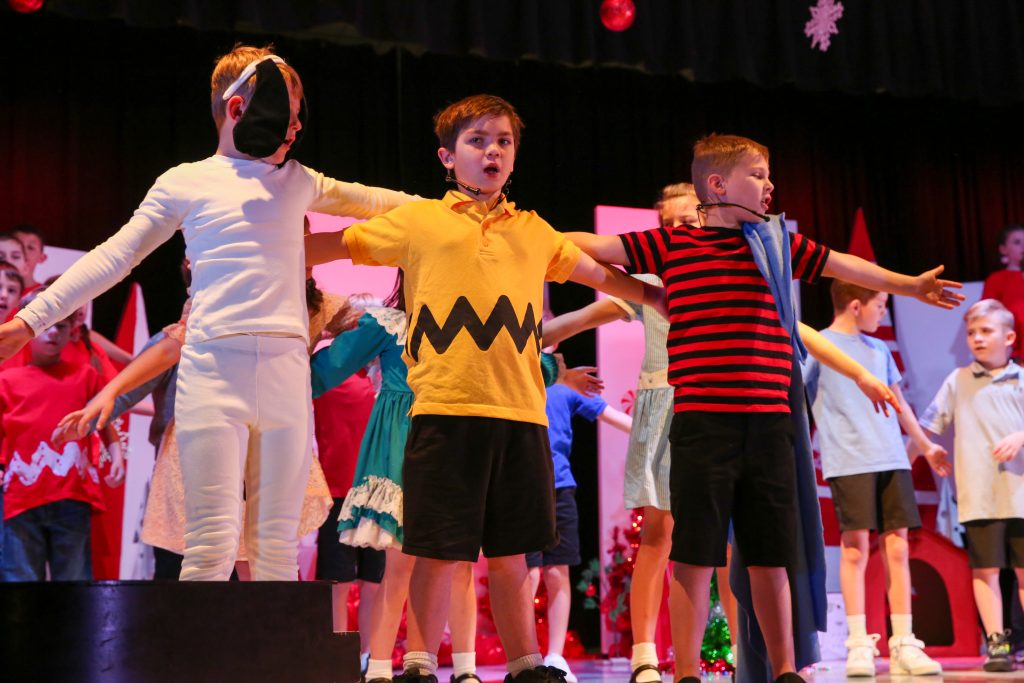Snoopy, Charlie Brown and Linus on stage