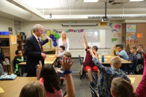 Dr. Jerry Thacker with Elm Road students in classroom (2019)