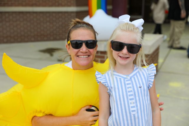 studnet with teachre dressed in sun costume